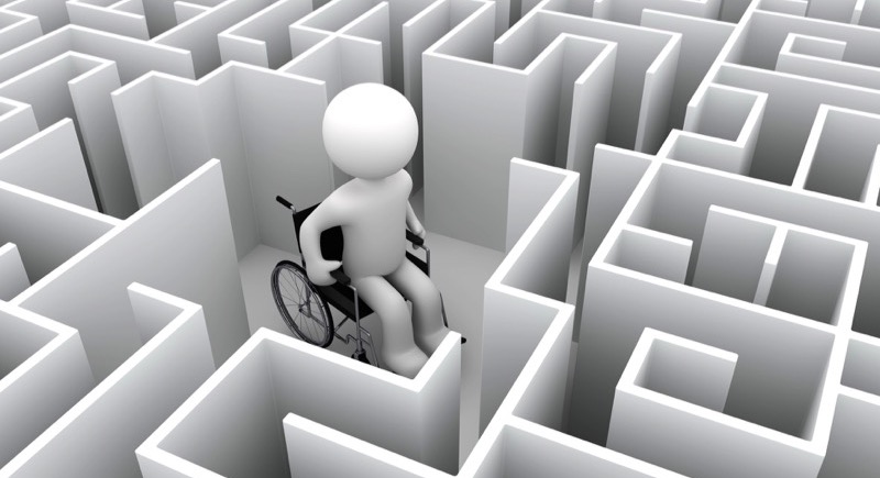 Motiv: Person i kørestol midt i en labyrint